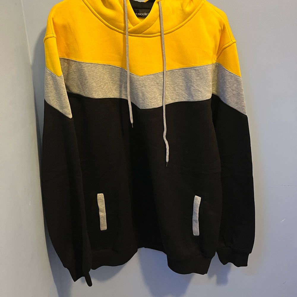 Never worn. Black grey and yellow hoodie